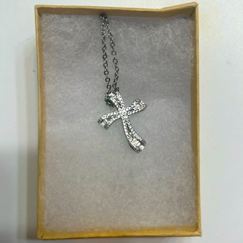 Swarovski cross necklace.